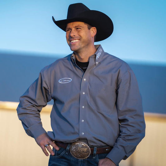 Professional horse trainer Jonathan Gauthier wearing a cowboy hat and belt buckle, showcasing expertise in reining and western horsemanship