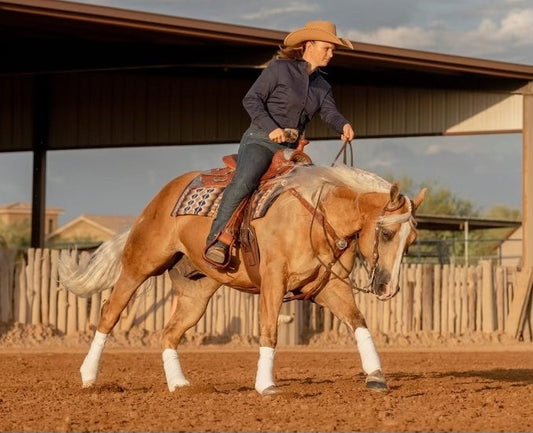 Linde Von Koeding loping her horse